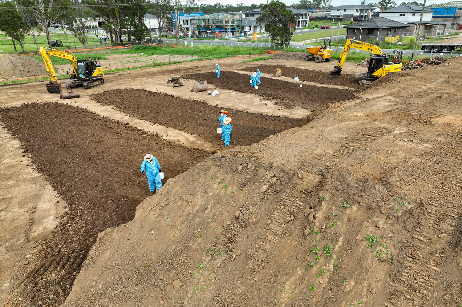 Workers carrying out contaminated soil remediation