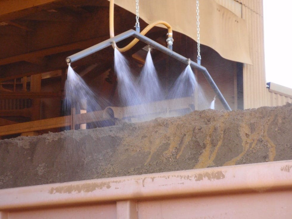 Rail car dust suppressant spray header